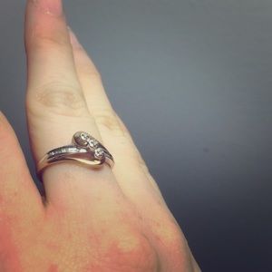 Diamond accent. 10k gold and silver ring